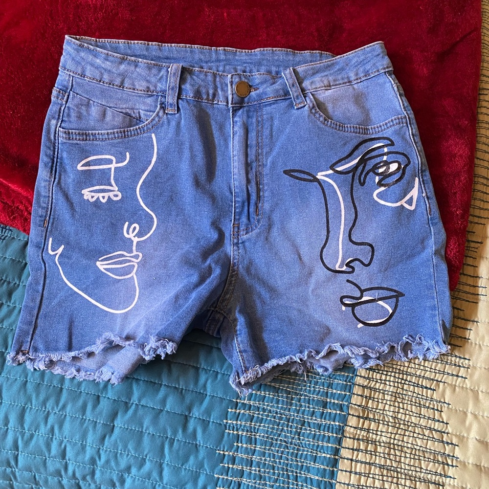Artsy face on jean shorts